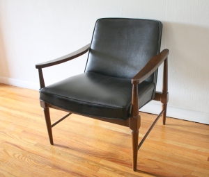 mid century modern chair with sculpted back detail 1